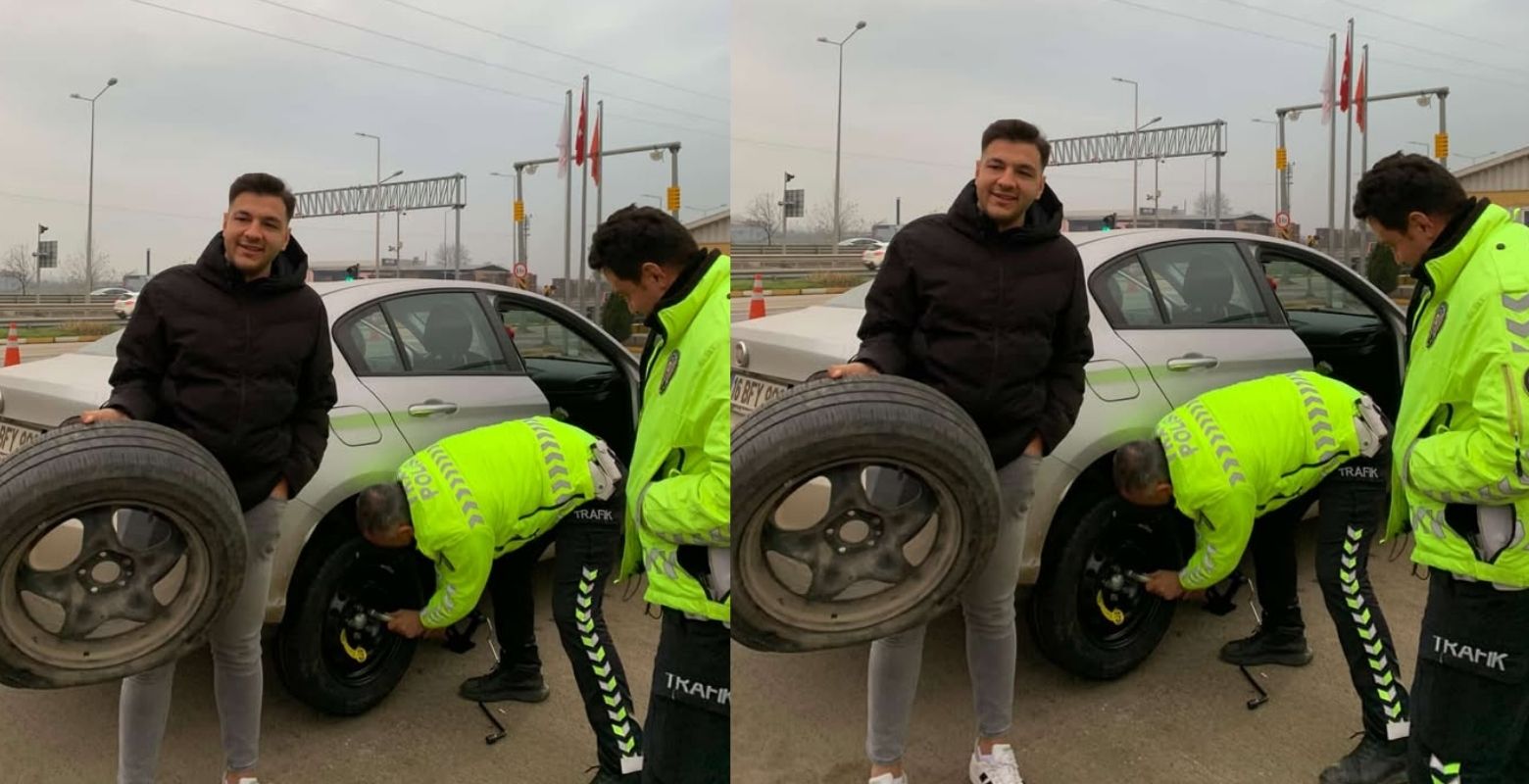 İnegöl'de patlayan lastiği polisler değiştirdi!